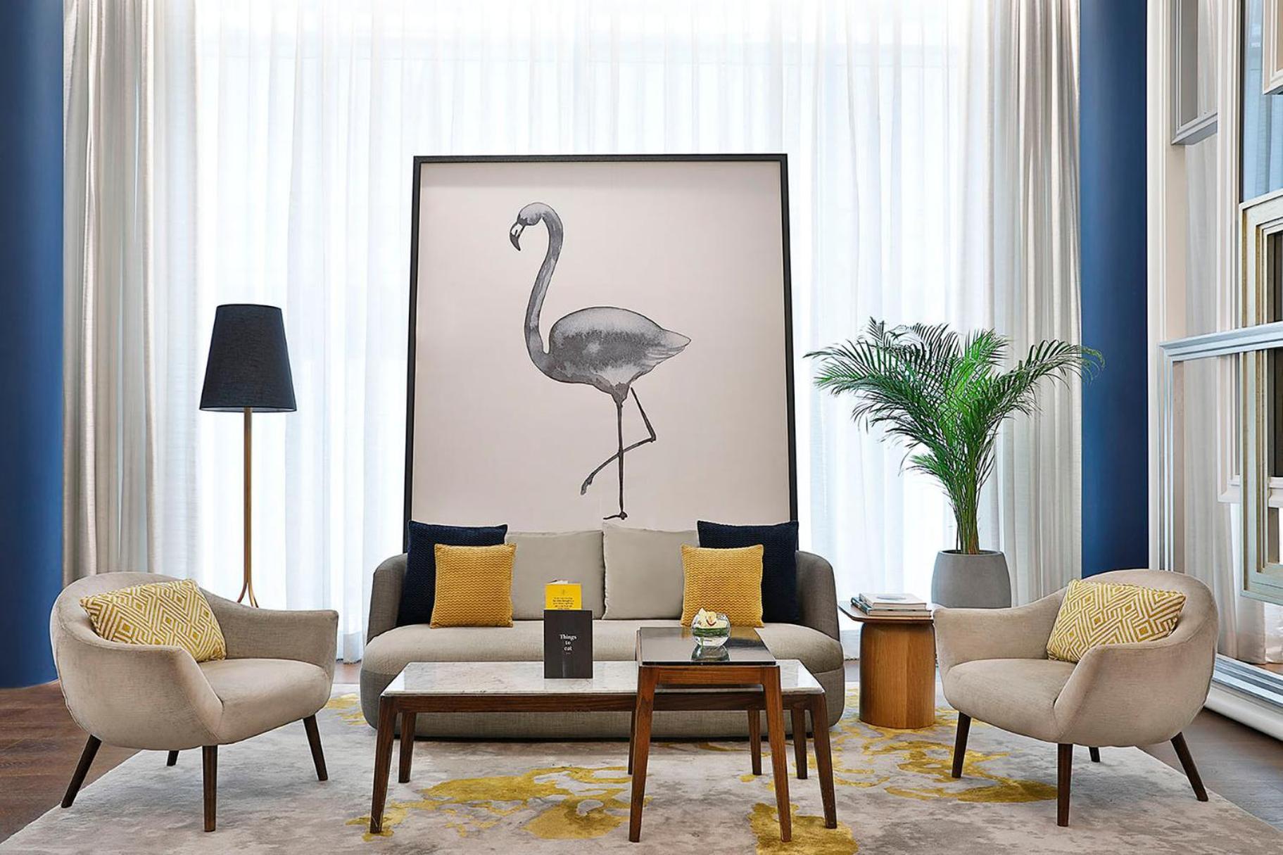 voco Dubai, an IHG Hotel Esterno foto A living room with a large painting